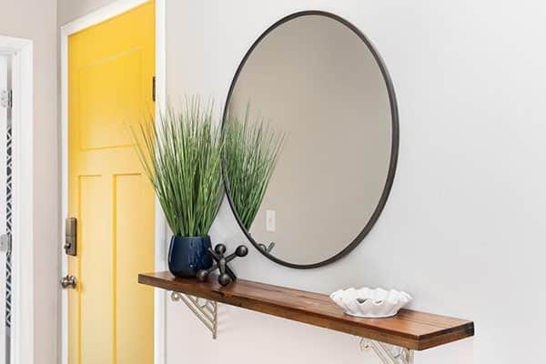 style the console below entryway mirror